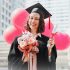 graduation day girl hold diploma and balloon congratulations on the graduation day.